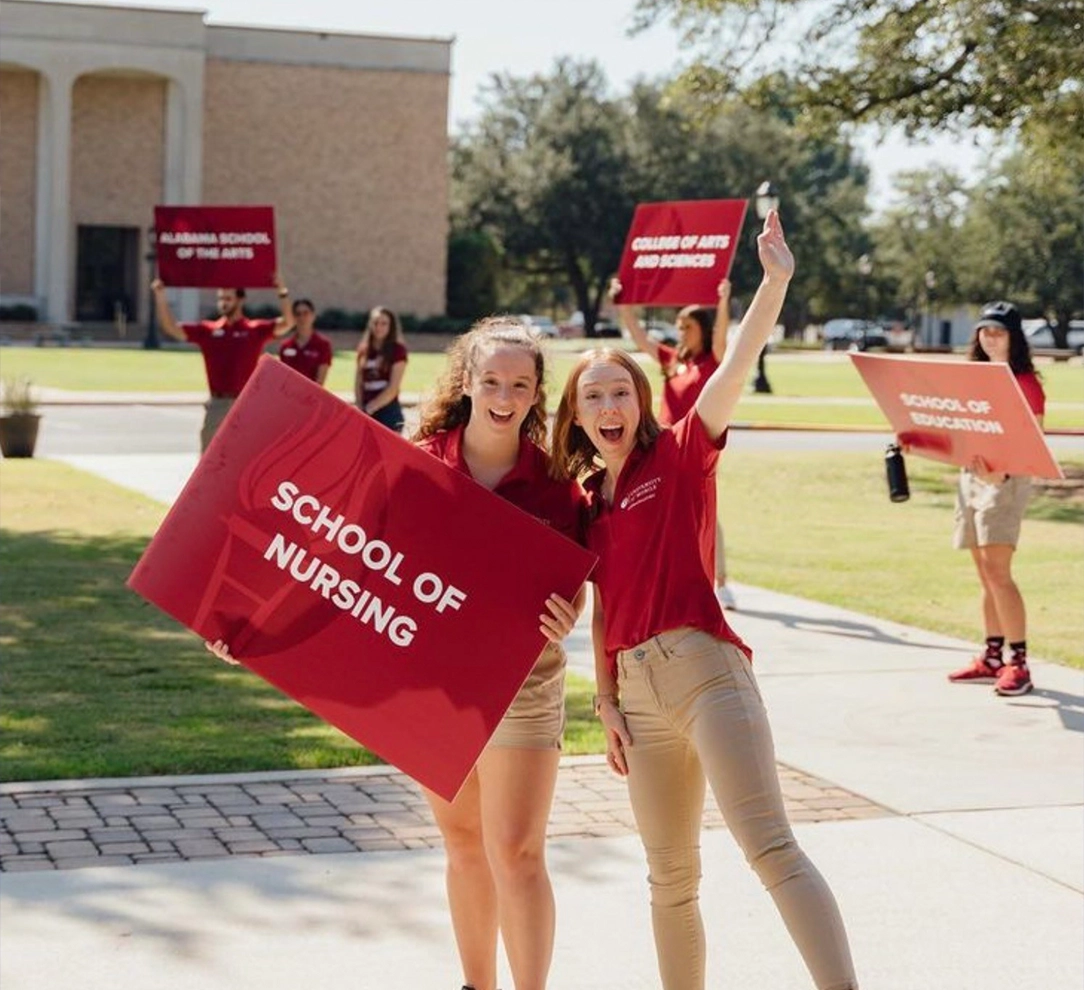 students holding up signs