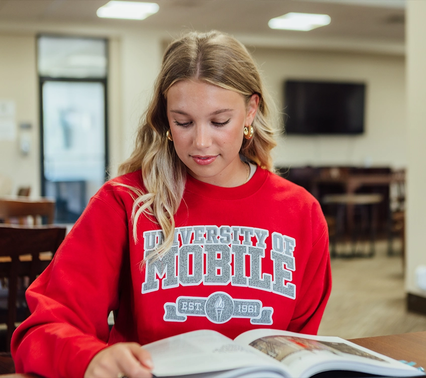 student reading textbook