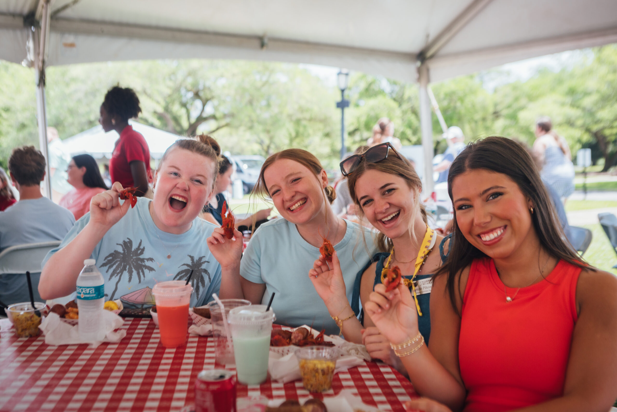 group of girls eating crawfish