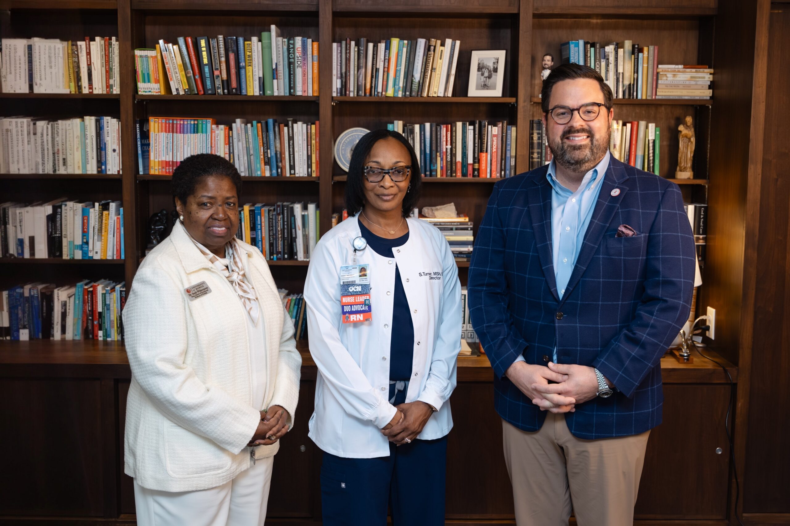From left, UM School of Nursing Dean Sarah Witherspoon, Stefanie Willis, UM President Charles Smith